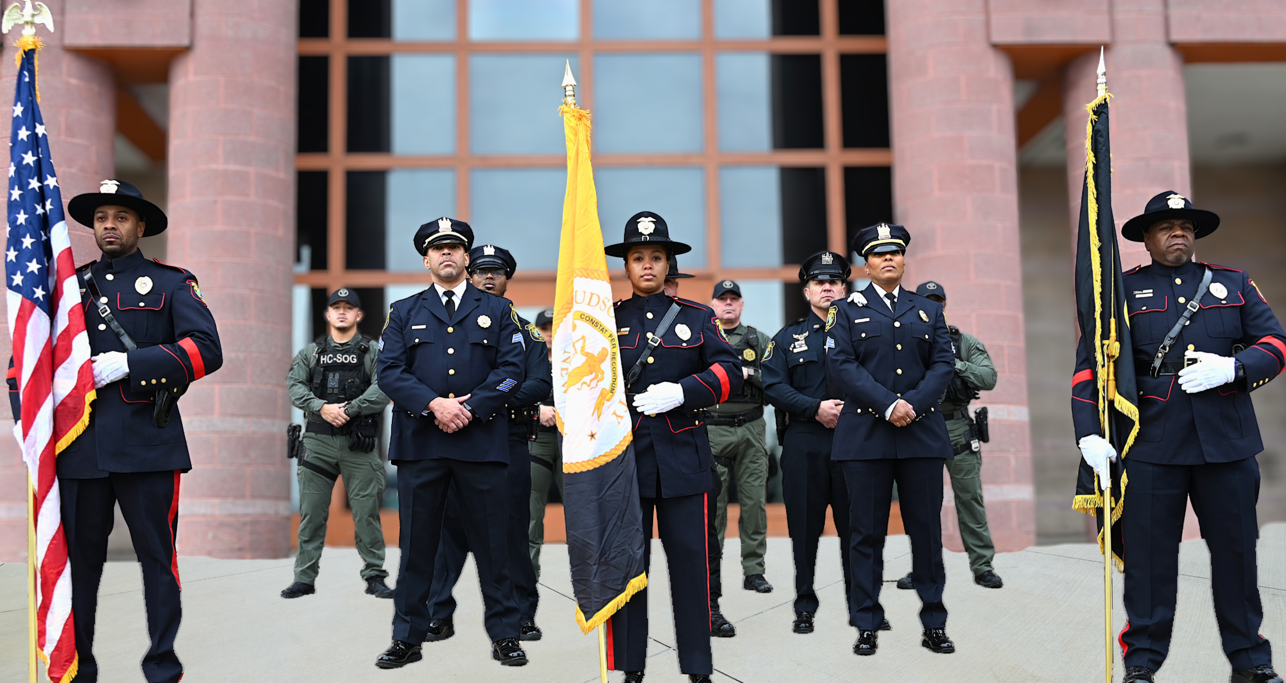 Several correctional officers standing in formation looking tough, yet approachable 